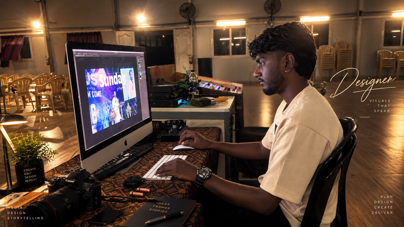 Mathew Walker designing at his desk in Photoshop